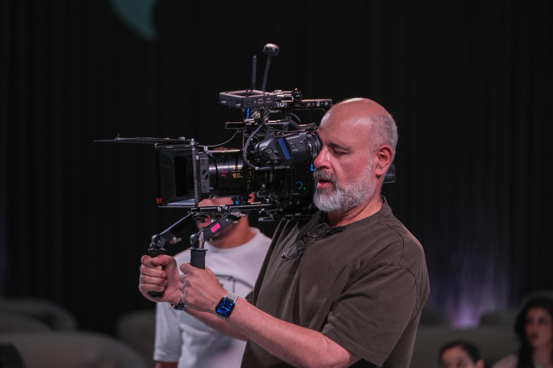 Ramy Rizkallah operating a cinema camera on set